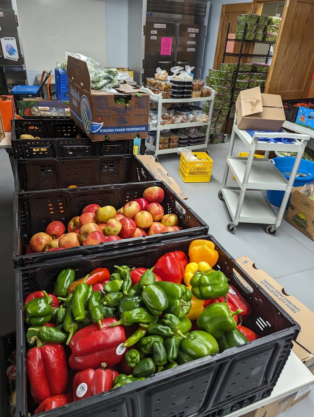 Fresh produce sorted in crates at the Food at First pantry